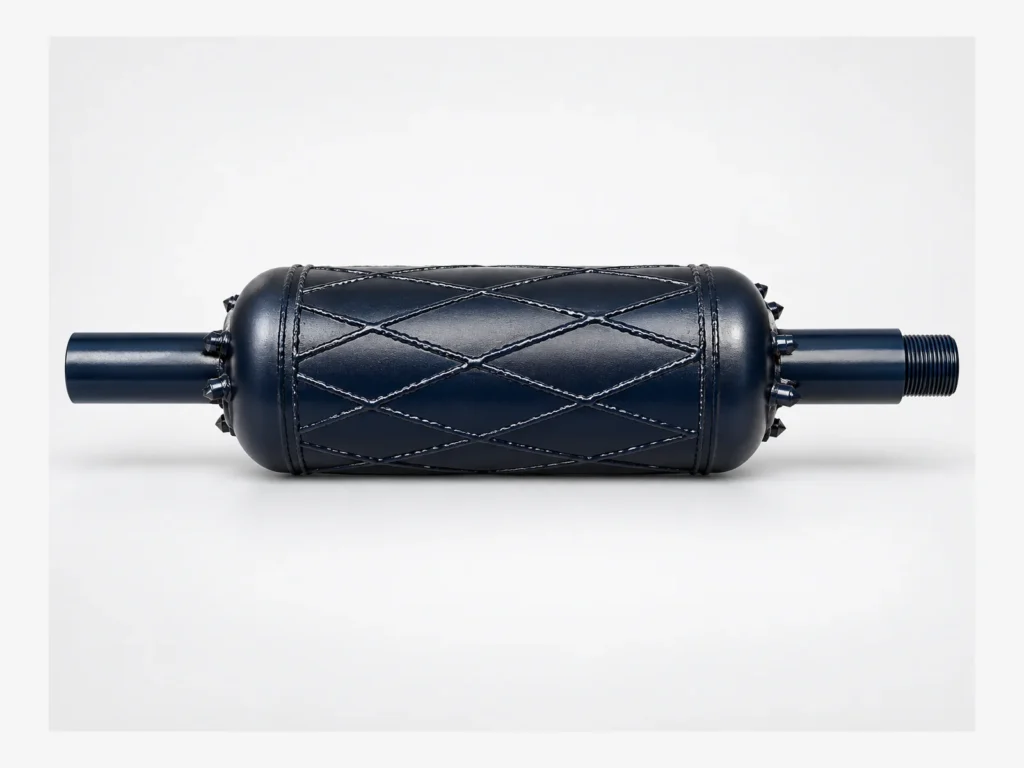 Dark blue Barrel Reamer with a cylindrical body, crossed hardfacing and carbide cutters.