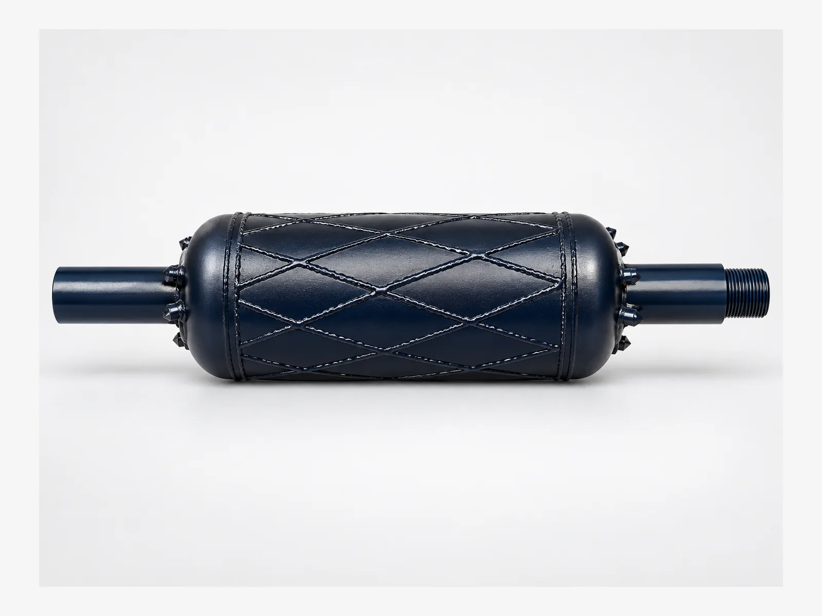 Dark blue Barrel Reamer with a cylindrical body, crossed hardfacing and carbide cutters.
